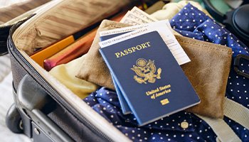 A passport inside of a luggage briefcase 