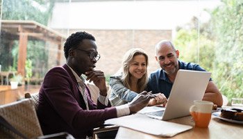 A couple purchasing a home with their escrow agent