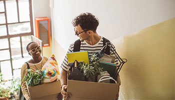 a happy couple moving into a new apartment