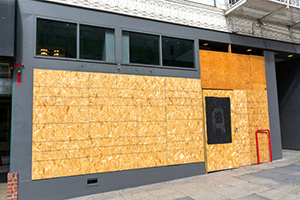 business's windows boarded up